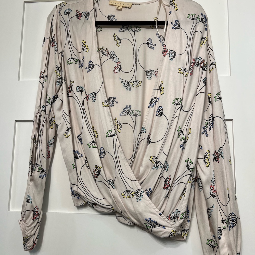 Silky, open, flowing top, very light pink background with floral print